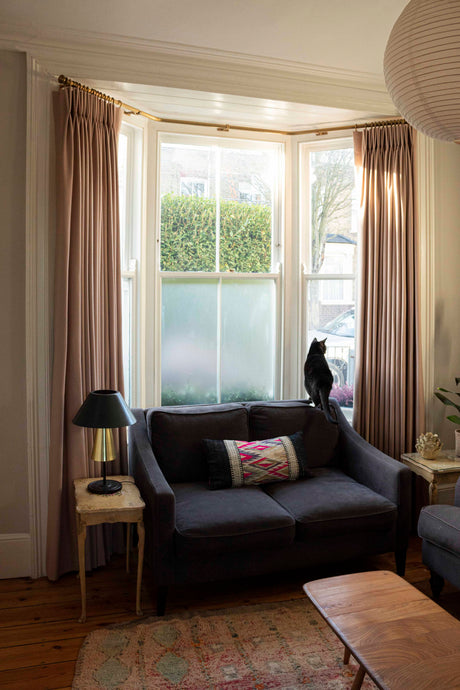 Double Pleat Curtains on a Dull Brass Pole
